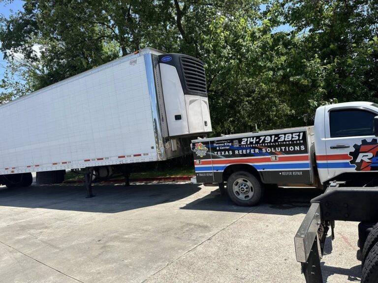 Texas Reefer Solutions service truck at a refrigerated trailer on a job site