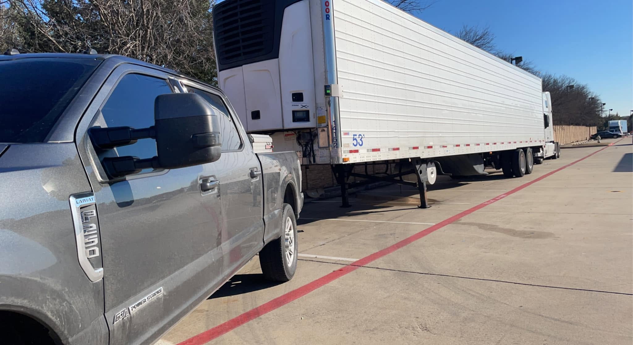 Texas Reefer Solutions technician servicing a refrigerated trailer reefer unit in Dallas, TX